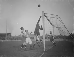 Football match - Dartford versus Colchester. The goalie makes a save