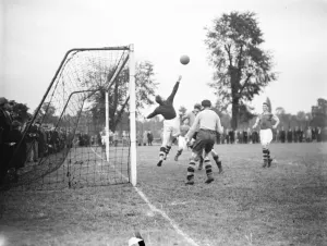 A football match in Swanley, Kent. Goalkeeper reaches for the ball
