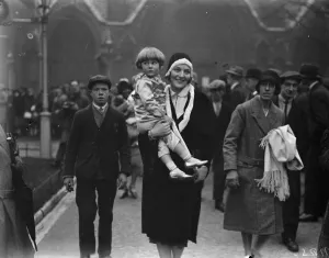 Frances Doble wedding. The little son of Commander Glen Kidston arriving with his mother