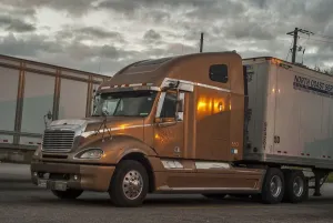 Distance Prints: Freightliner 6x4 semi with a box trailer parked up on HY 401 service station SW