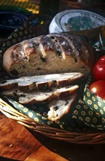 Savoury Collection: French olive bread with tomatoes and cheese in basket in gentle warmth of spring