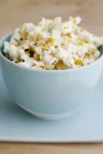 Blue Prints: Freshly popped pocorn in pretty blue bowl credit: Marie-Louise Avery / thePictureKitchen