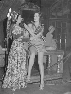 Future beauty lends a hand to the past. Well-known women, in costume, are appearing