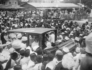 Gandhi addresses university students in Poona, India. Mr Gandhi leaving Reay Market