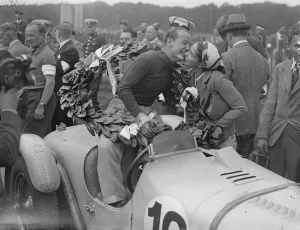 Gianfranco Cometti garlanded with laurels and being kissed by his wofe after his