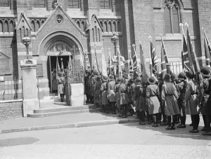 Uniforms Prints: Girl Guide rally. Guides waiting to enter the church. 1935