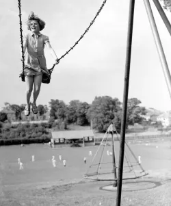 Playing Prints: Girl on a swing in the park. 1939