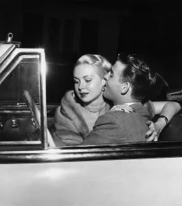 1950s Prints: Glamorous American actress, Joi Lansing in a romantic embrace with her boyfriend