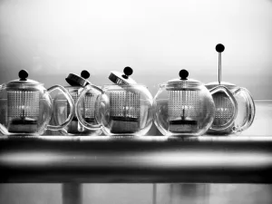 Preparation Prints: Glass Bodum teapots on metal shelf in restaurant credit: Marie-Louise Avery / thePictureKitchen