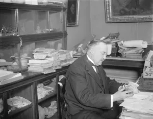 The Glozel Hoax view of Famous French scientist. M Rene Dussaud photographed in his bureau