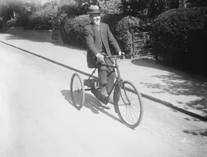 Prints of Going the pace at 90. Mr G Salmon, of Harpenden Midland Railway station, who has attained his 90th birthday, is still extremely active. Mr Salmon on his tricycle at Harpenden. 27 August 1926 1920s Prints: Going the pace at 90. Mr G Salmon, of Harpenden Midland Railway station, who