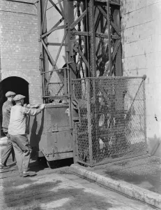 Gravesend Gasworks in Kent. Loading gas coal into retorts. 1939