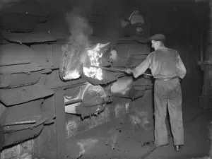 Industrial Prints: Gravesend Gasworks in Kent. Loading gas coal into retorts. 1939