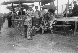 The great Derby week. A coster and his family having alfresco lunch. Pearly King