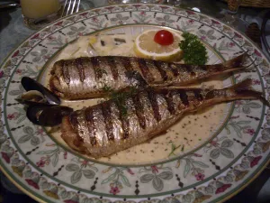 Lifestyle Prints: Grilled herring served in a sauce on a dinner plate in a restaurant