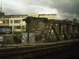Town Prints: Grim built-up area and landscape of railway architecture with brickwork and bridge