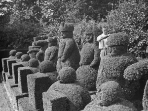 A groundsman trims the topiary figures at Hever Castle. 1938