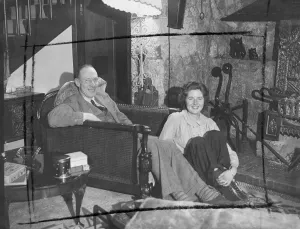 Smiling Prints: Group Captain harry Day enjoys a quiet rest by his own fireside at his country house