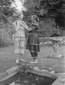 Guests wear bathing costumes of the 19 century at London party. At a party given