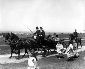 Horses Prints: Gypsy children run after the Royal Carriage of King George V as they travel over
