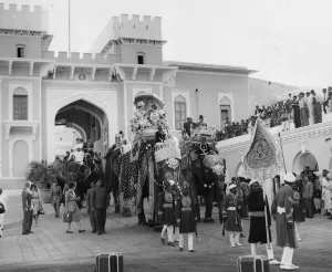 H. M. Queen Elizabeth II and Prince Philip occupy separate elephants for the ride