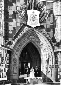 H. M. Queen Elizabeth II and Prince Philip standing under the arch of the Peace Tower