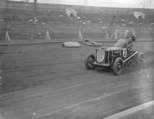 Hair raising. Woman driver takes up midget car racing