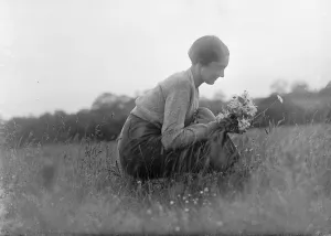 Haken. Miss Silhouette. Young woman picking wild flowers in a field. 1935