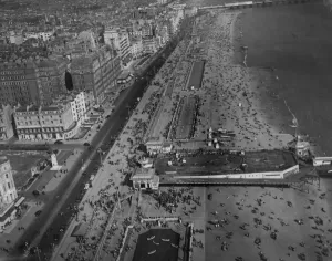 Aerial View Prints: Hastings beach photographed from the air wih hundreds of holiday makers enjoying the beach