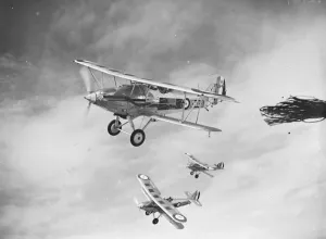 A Hawker Hart of No. 23 Squadron RAF flying in formation over the Medway area in Kent