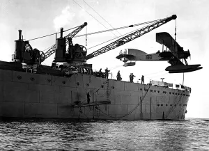 Warship Prints: Hoisting out a seaplane from British seaplane carrier HMS Ark Royal, Mudros