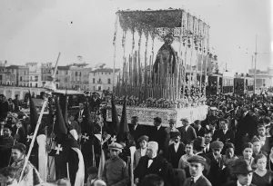 Parade Prints: Holy week in Seville. The Virgin of Protection passing over the famous Triana Bridge