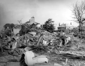 Britain Prints: Home front 1940. The aftermath of a German air raid in which landmines (dropped