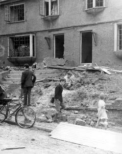 Britain Prints: Home front 1940. Children in amongst the debris and rubble of Northfleet houses