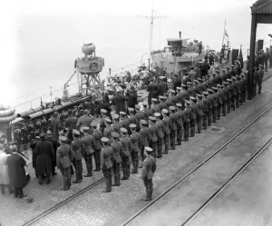 Home coming of Unknown Soldiers on H. M. S. Verdun on way home to England. Saluting