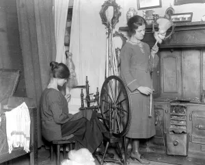 Home dyeing and weaving industry at Alston Studio. The pupil on the right has