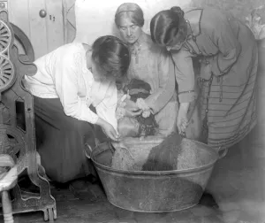 Framed Print : Home dyeing and weaving industry at Alston Studio. Rinsing the wool after a bath Framed Print : Home dyeing and weaving industry at Alston Studio. Rinsing the wool after a bath