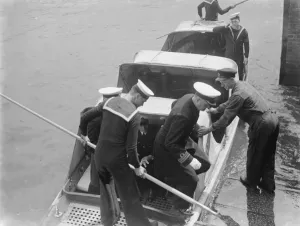 Sailor Prints: The Home Fleet on the river Thames at Erith, London. Sailors debark from a boat