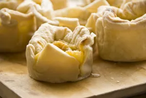 Home made portuguese style custard tarts with confectioners custard and puff pastry credit