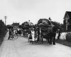 Agricultural Prints: Hop pickers returning from the Kent fields loaded up with full sacks of hops - 1935