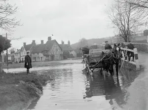 Animal Prints: A horse and cart wades throug the ford at Eynsford in Kent watched by schoolboys