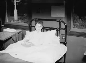 Now in his hospital bed, JW Davies, found on the electric line at Barnehurst
