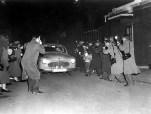 Photographers Prints: A host of press photographers descend upon the car belonging to Group Captain Peter