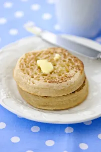 Snack Prints: Hot buttered crumpets on white plate credit: Marie-Louise Avery / thePictureKitchen