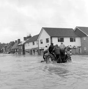 Householders salvaging what belongings they can - at the Southern end of High Street Edenbridge Kent on Sunday evening. 11 September 1968