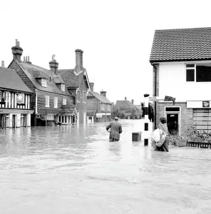 Householders salvaging what belongings they can - at the Southern end of High Street Edenbridge Kent on Sunday evening. Note the wellington boot stuck on the signpost! 11 September 1968