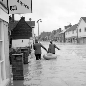 Householders salvaging what belongings they can - at the Southern end of High Street Edenbridge Kent on Sunday evening. 11 September 1968