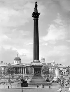 Tourists Prints: An iconic London landmark, Nelsons Column in Trafalgar Square with the National