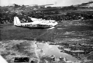 International Herald Tribune Prints: Imperial Airways Empire flying boat Centaurus speeding across Port Melbourne