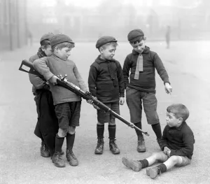 Weapon Prints: Infants of the Blackhorse Road School, Walthamstow playing with a German rifle that